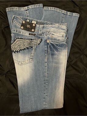 Miss Me Light Blue Faded Bootcut Jeans with Wing Pocket Detail.  34 inseam